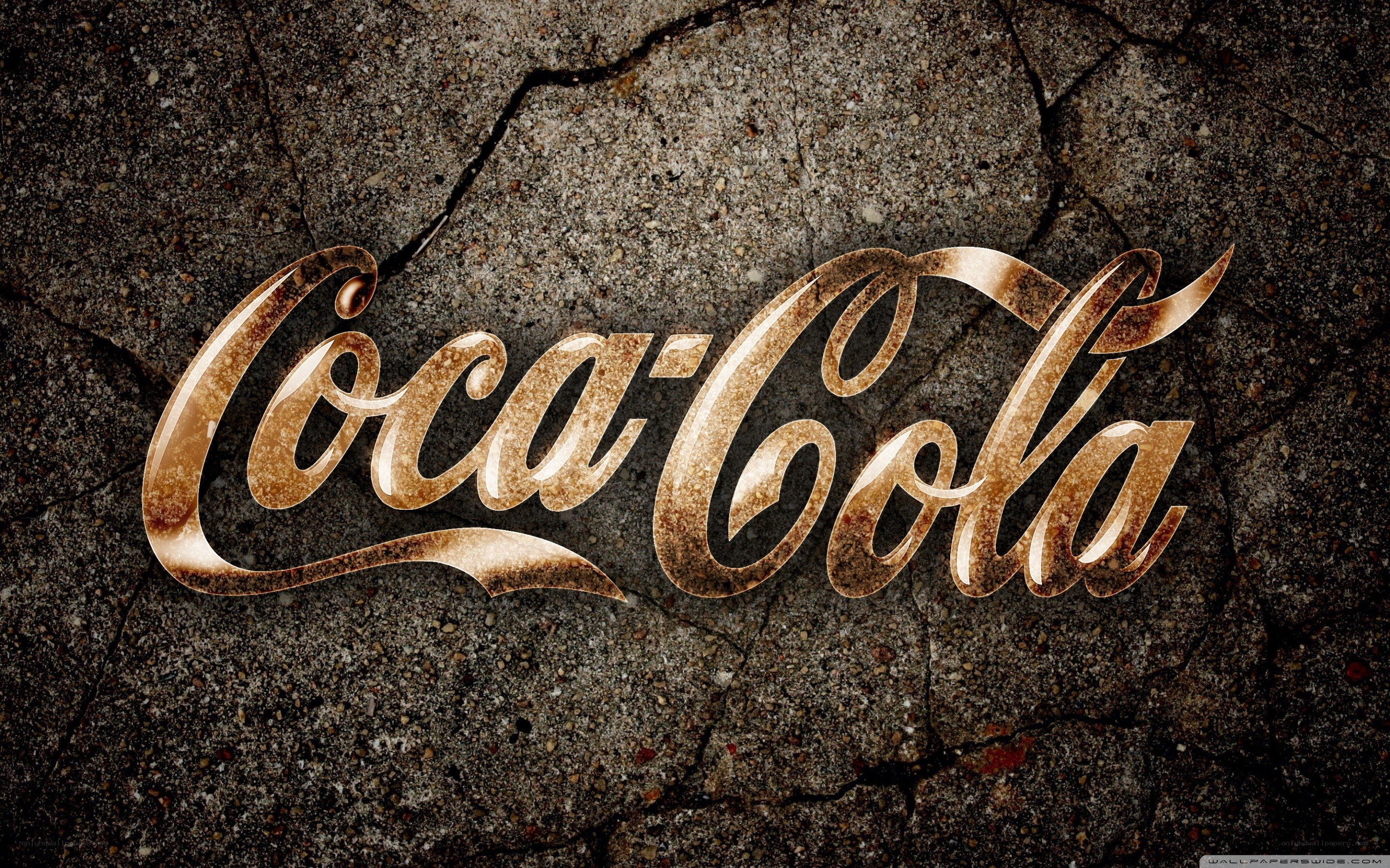 Coca-Cola logo on cracked concrete