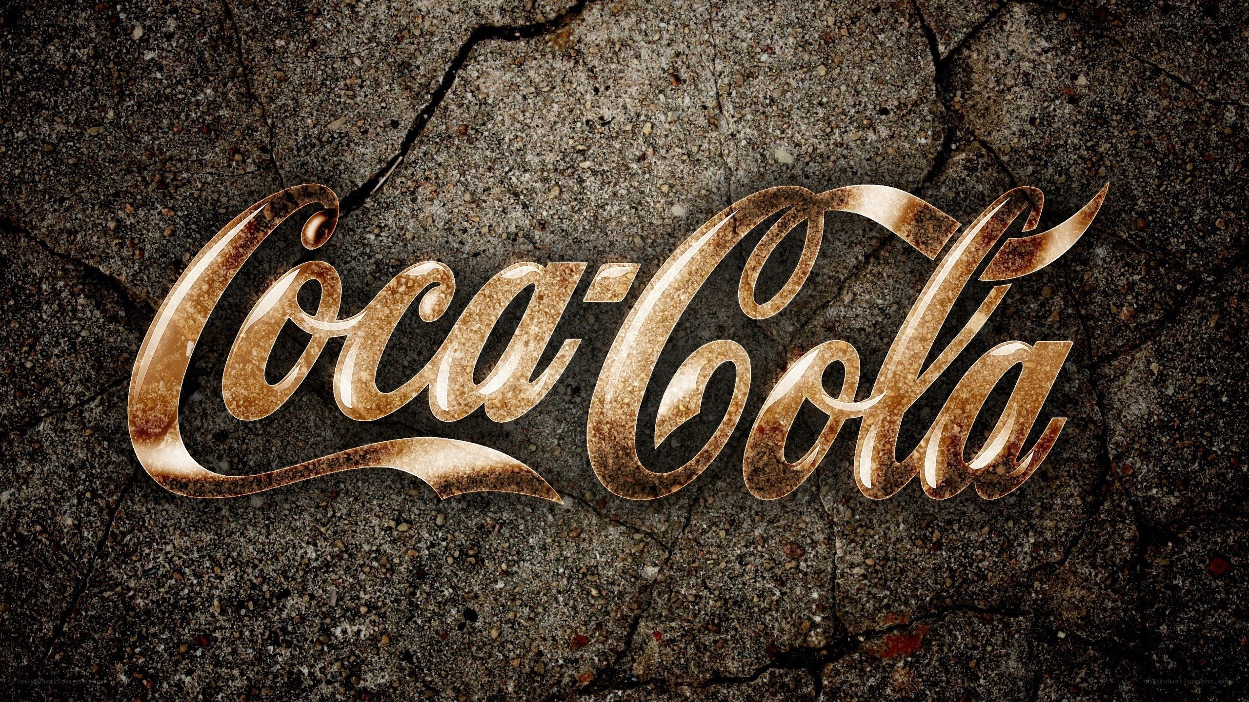 Coca-Cola logo on cracked concrete