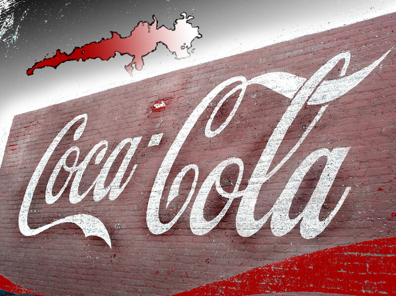 Coca-Cola sign on brick wall