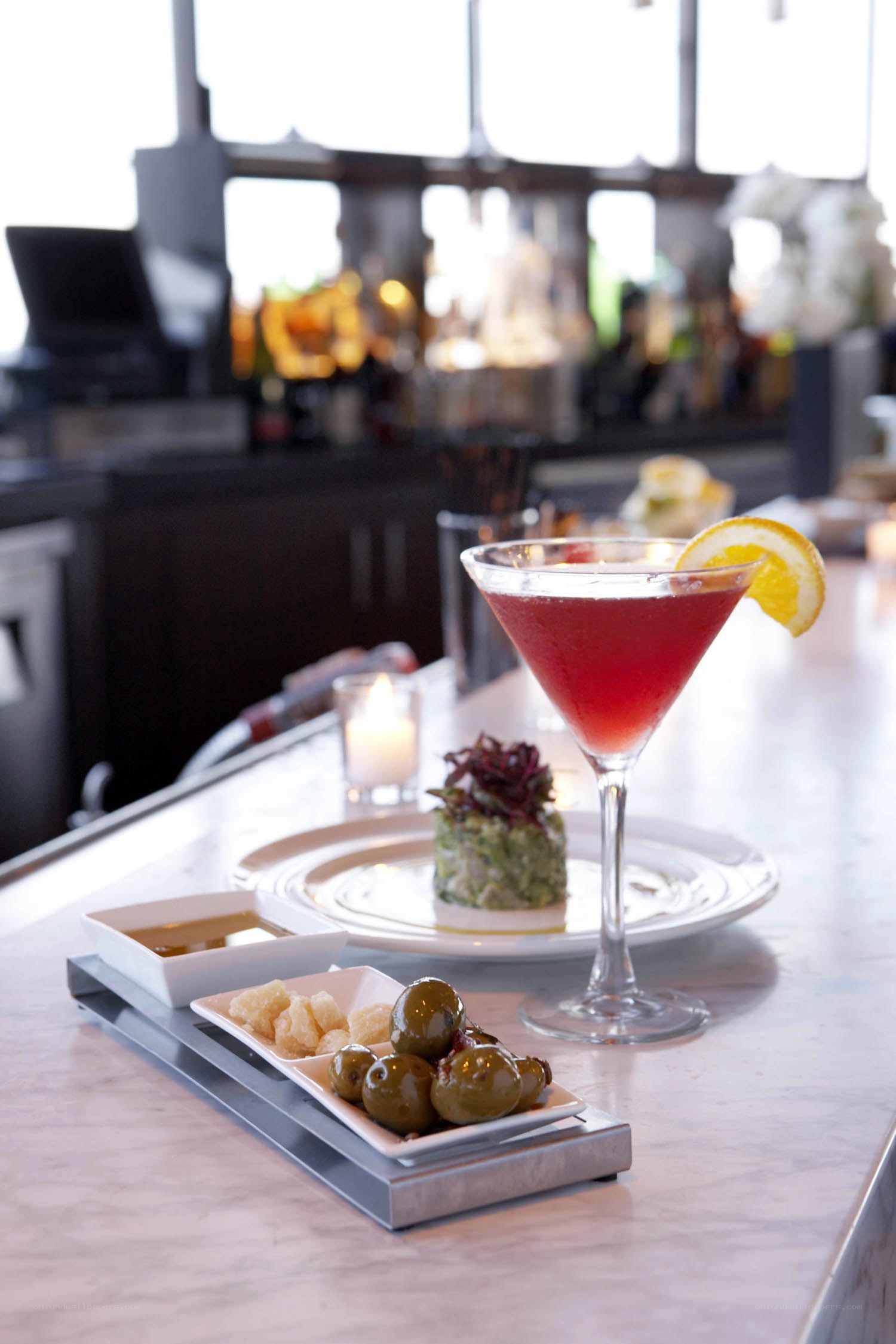 Cocktail and appetizers at bar