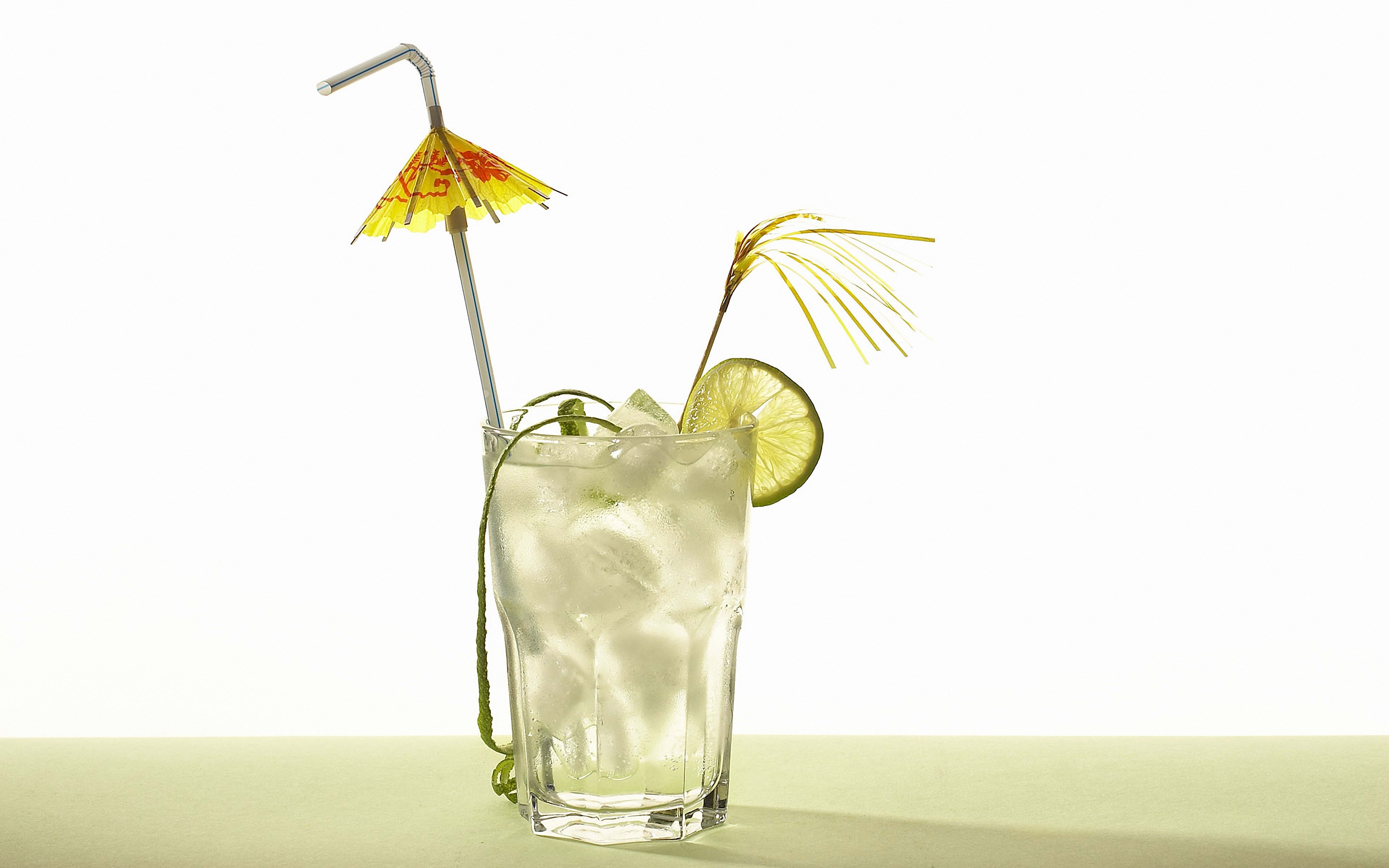 Cocktail with lime and umbrella