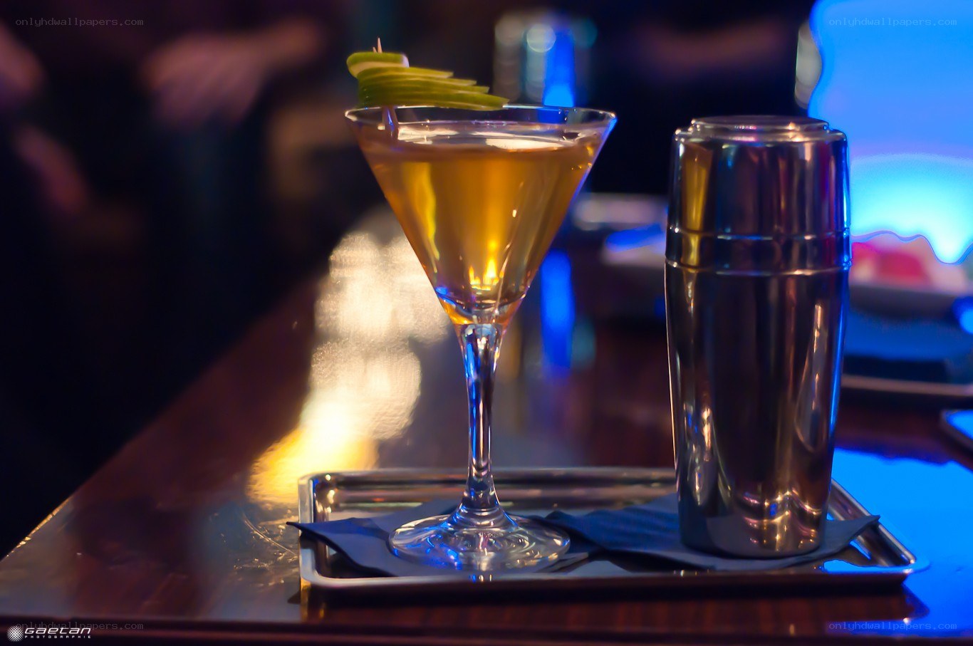 Cocktail with shaker on tray
