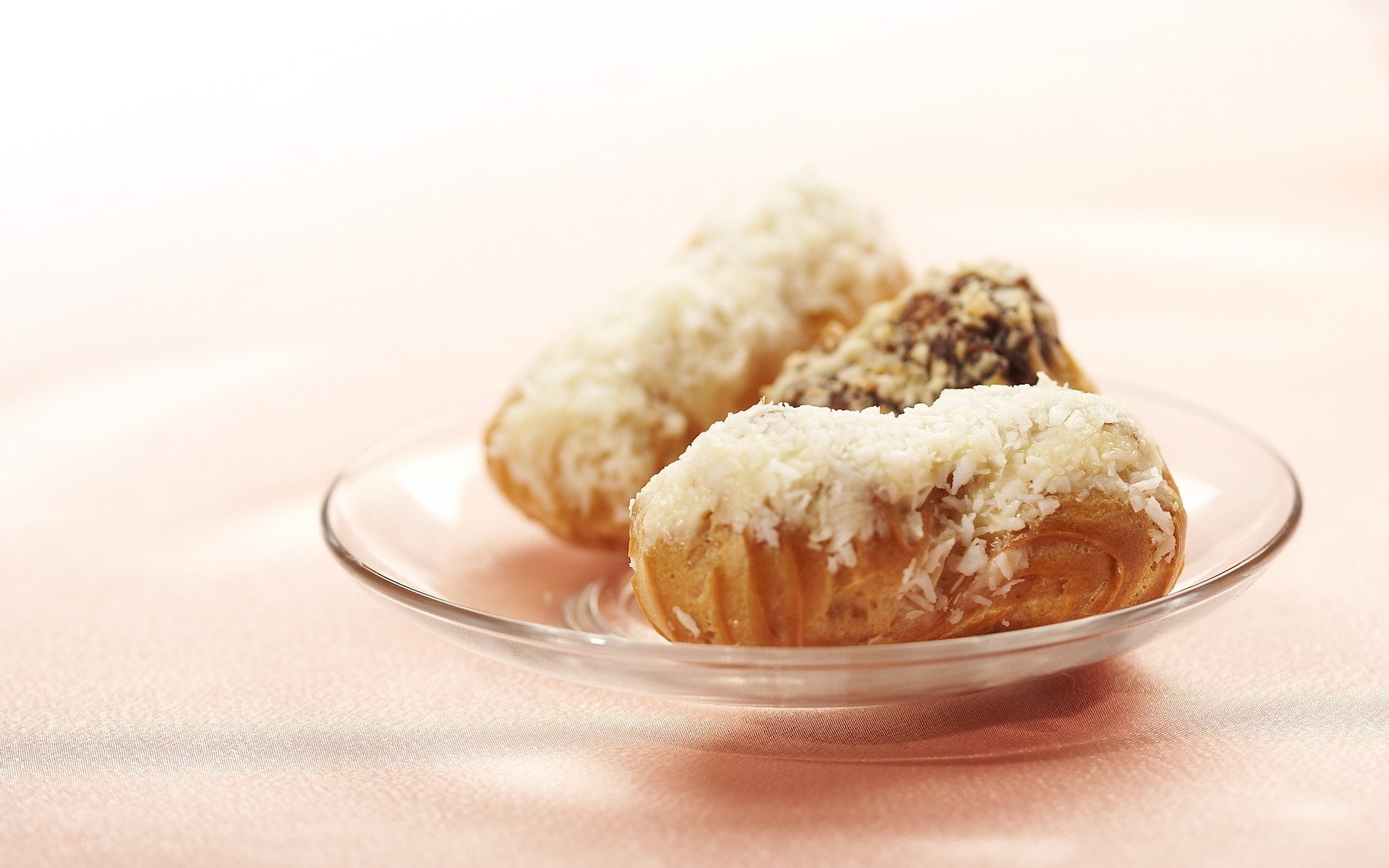 coconut-covered pastries on a plate