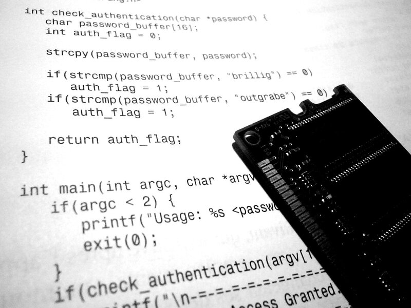 code on paper with circuit board