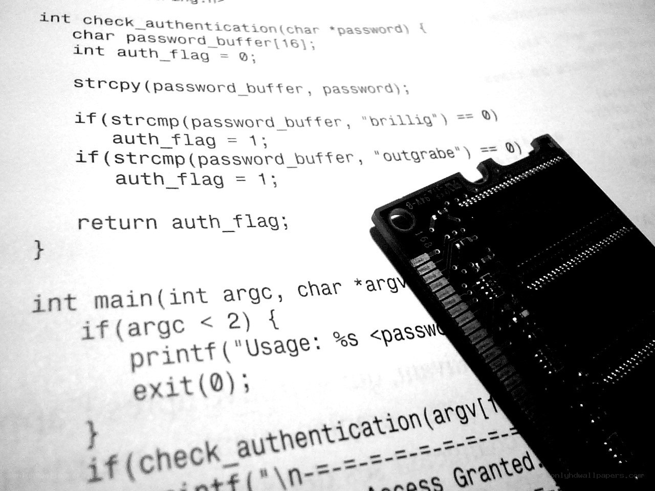 code on paper with circuit board