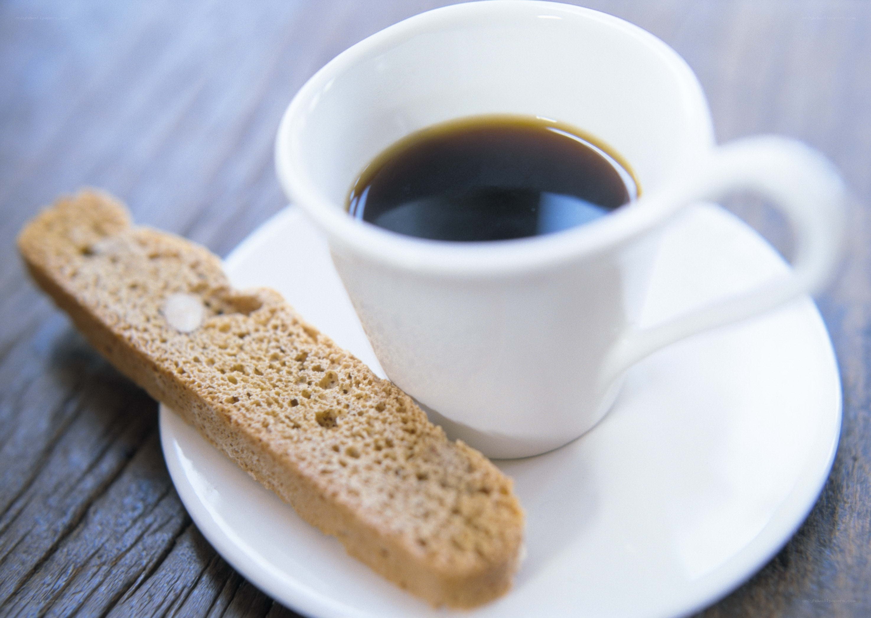 coffee and biscotti on wood