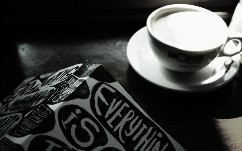 coffee and book on table