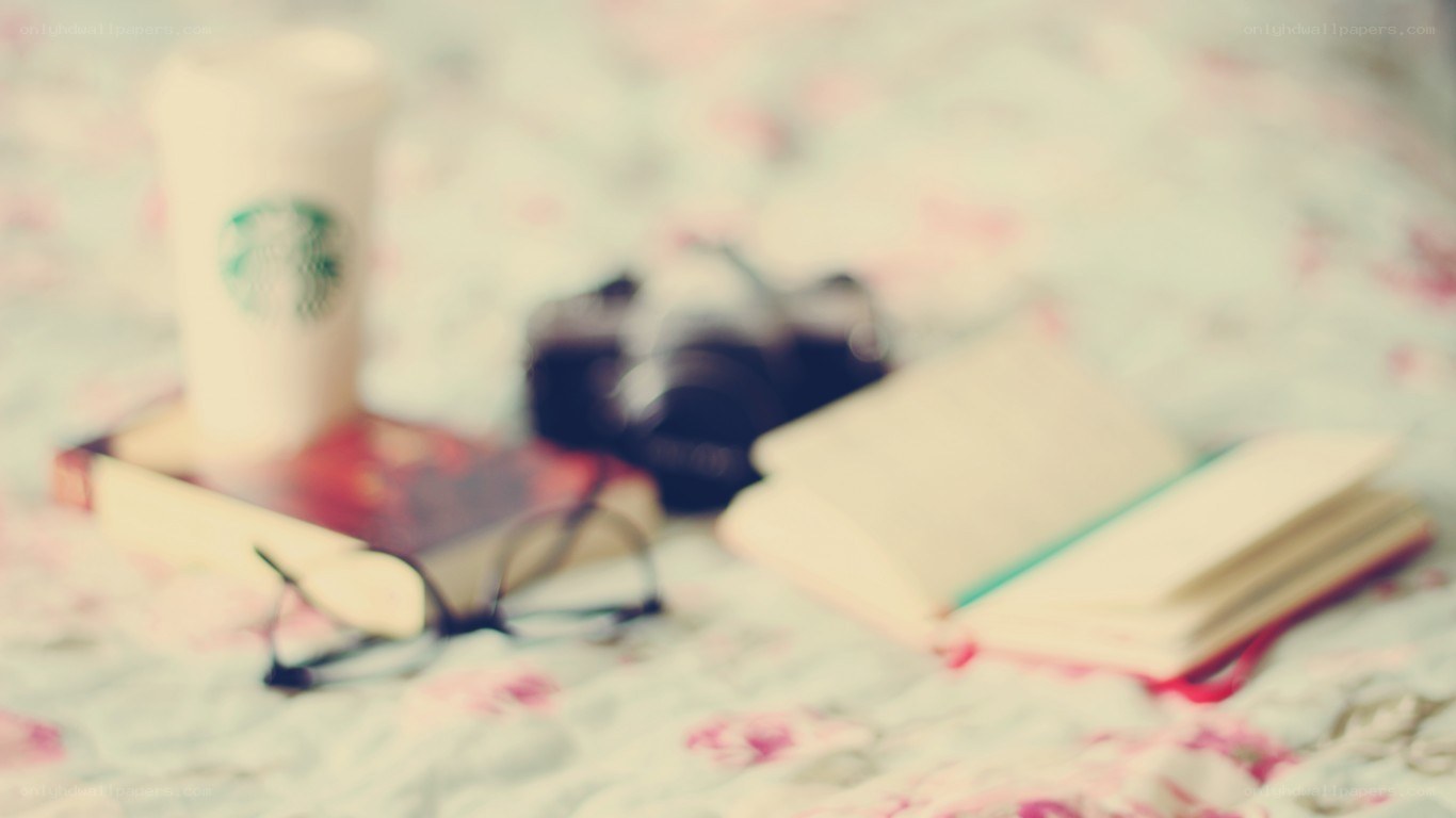 coffee and books on bed