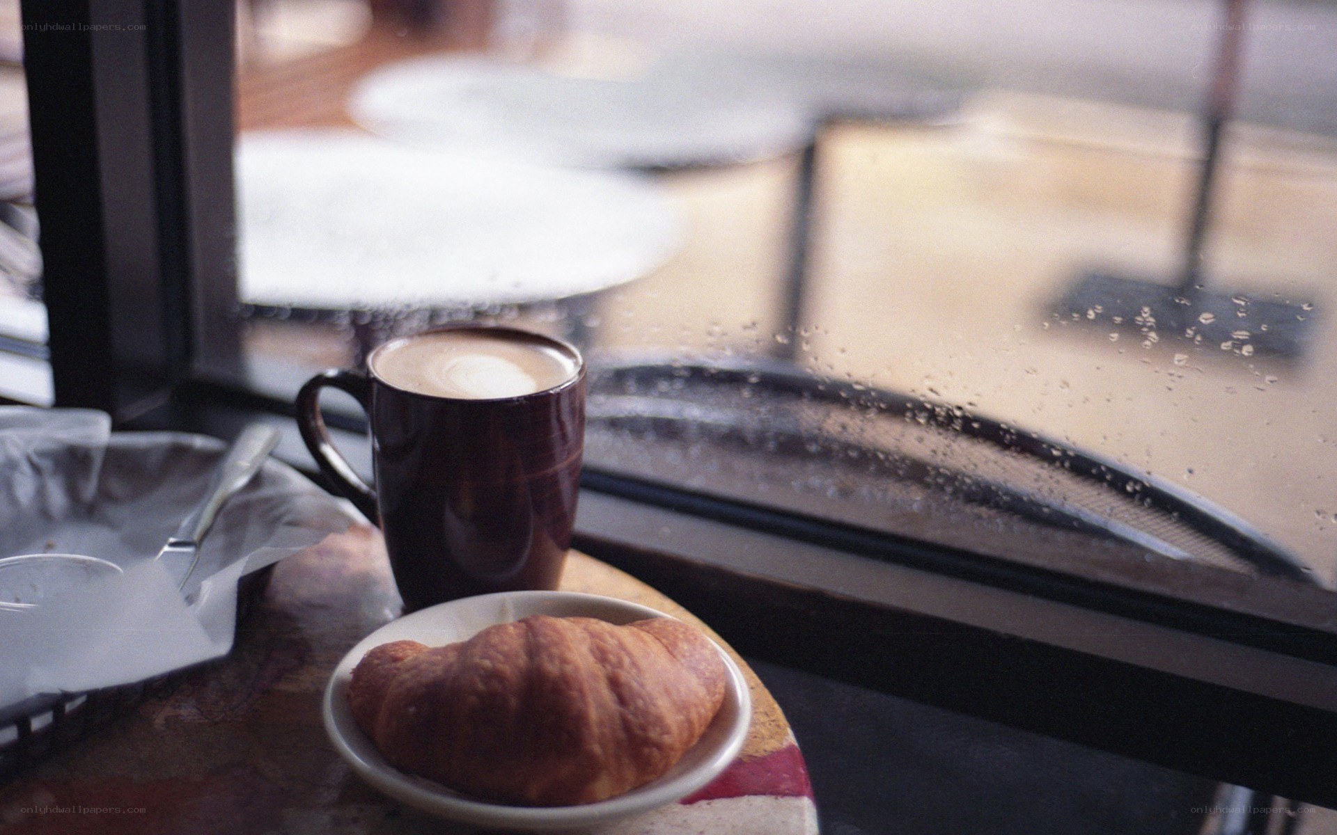 coffee and croissant by the window