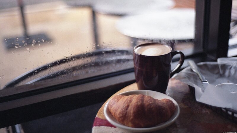 coffee and croissant by window