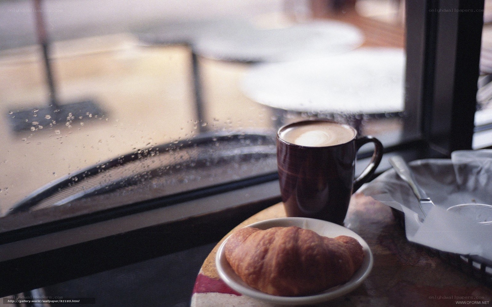 coffee and croissant by window