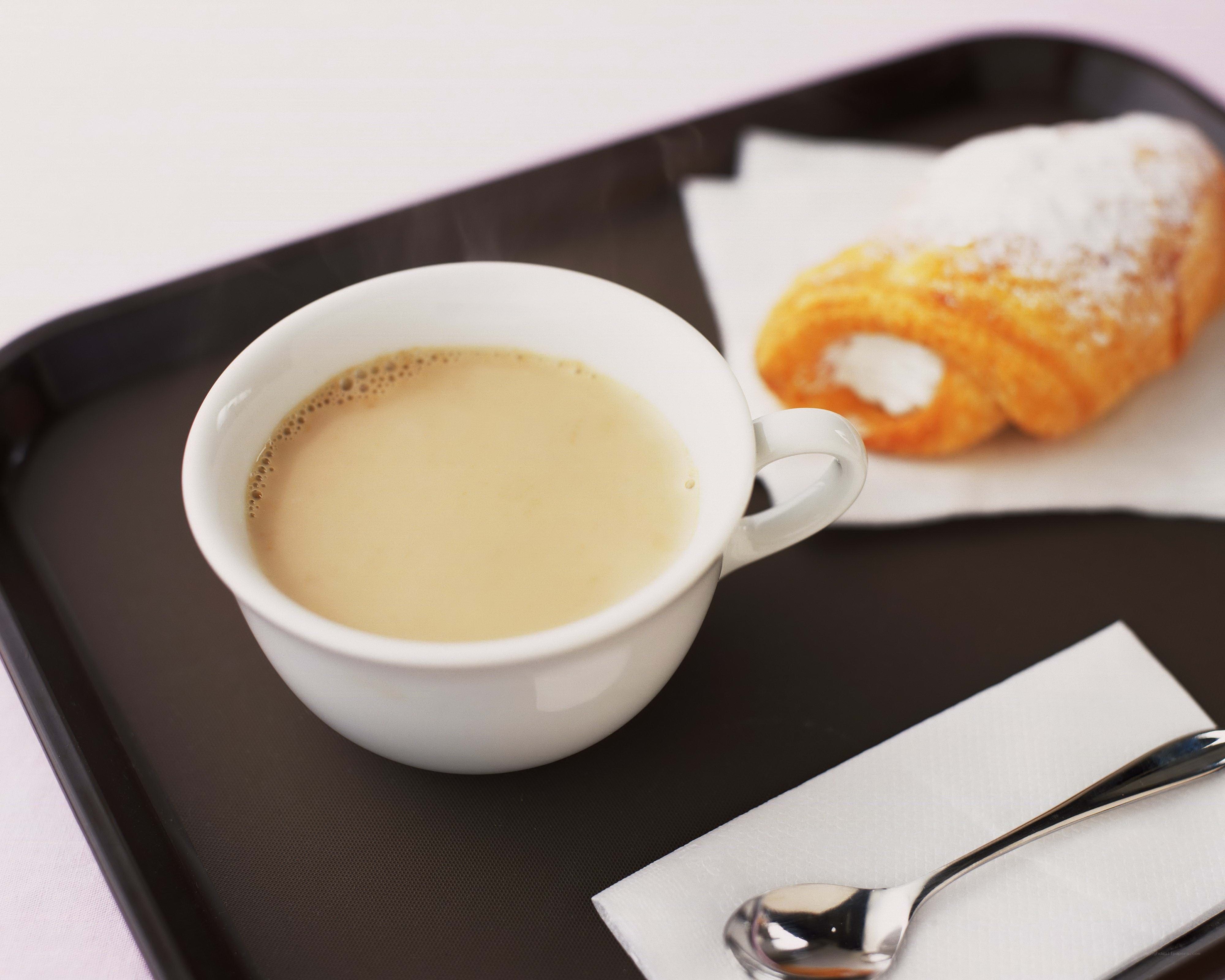 Coffee and croissant on tray