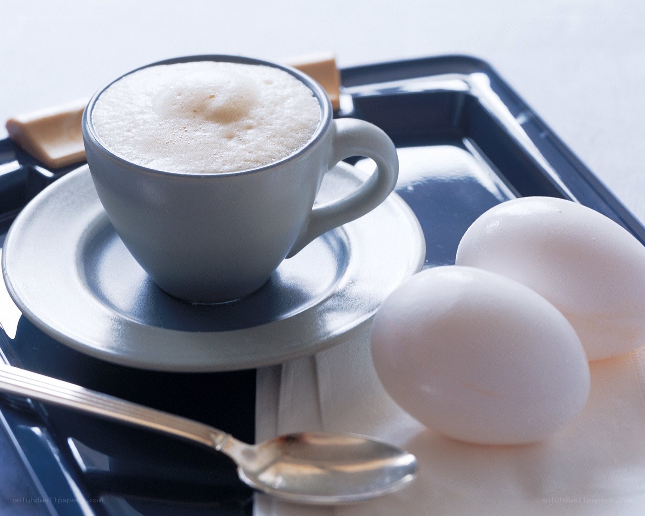 coffee and eggs on tray