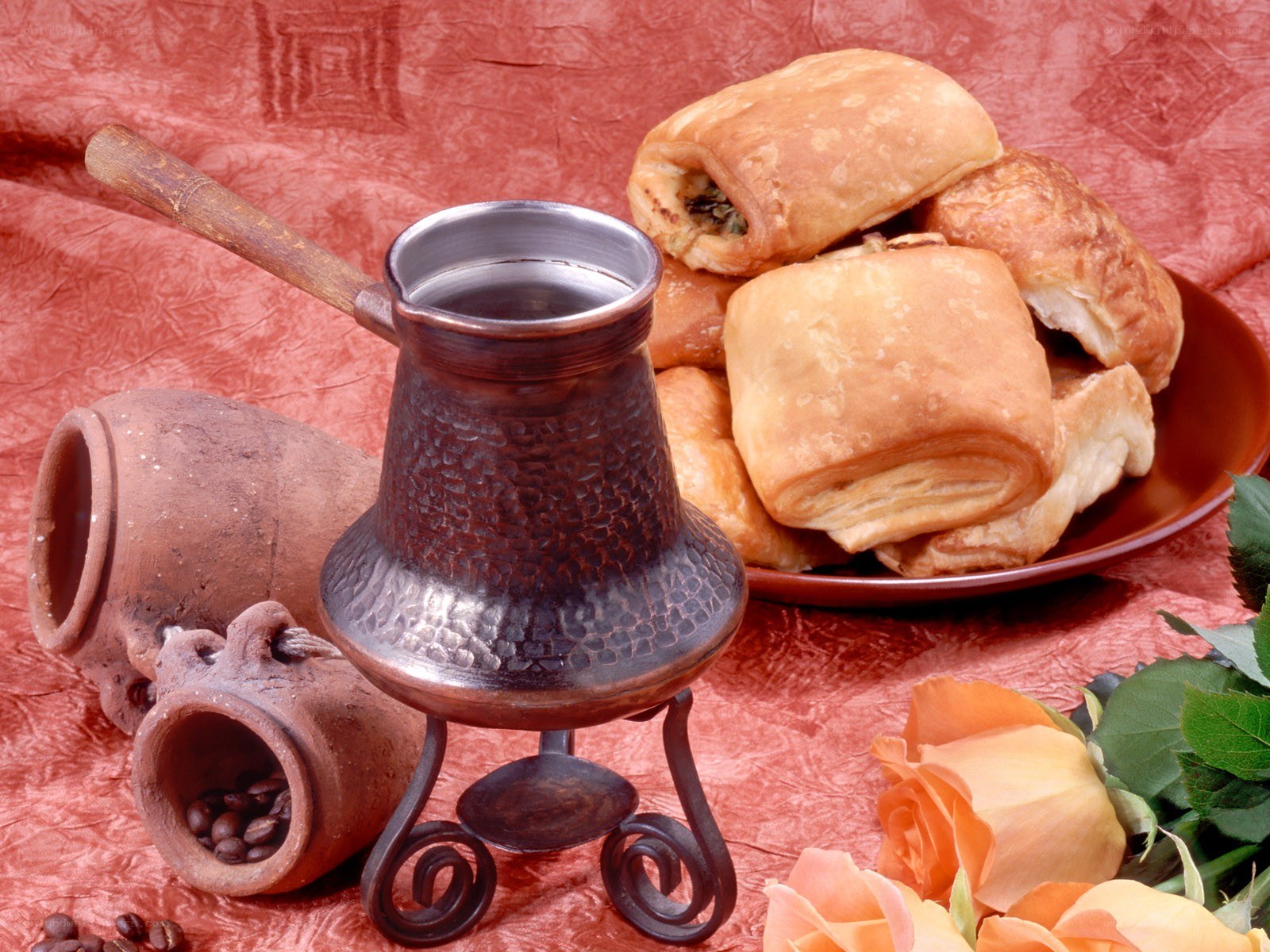 Coffee and pastries on red cloth