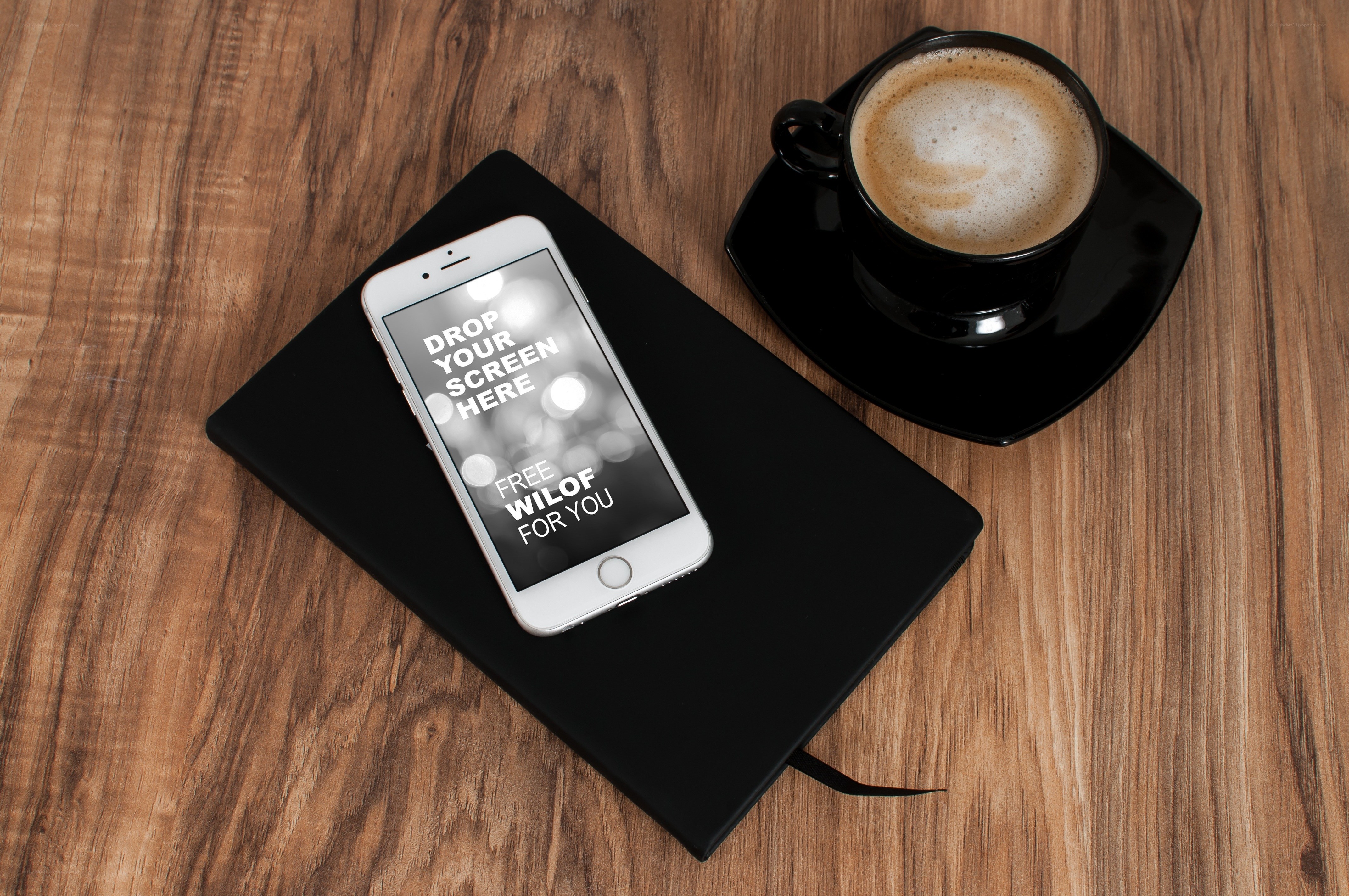 coffee and phone on wood table