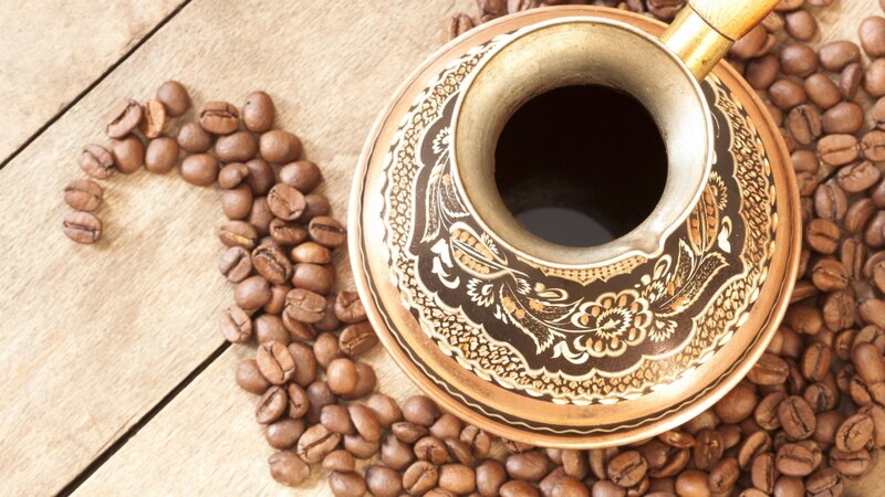 coffee beans and copper pot