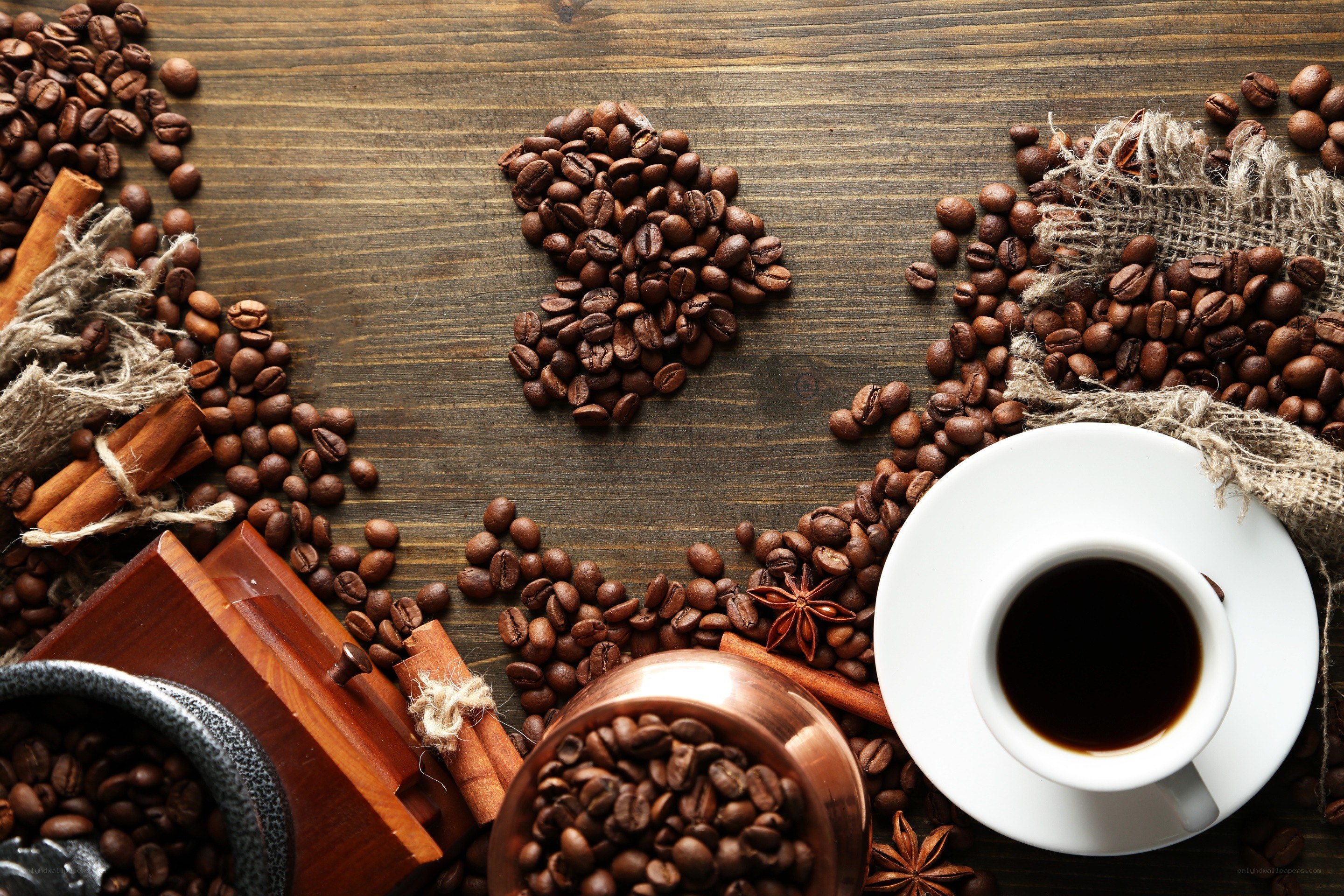 coffee beans and cup on wood