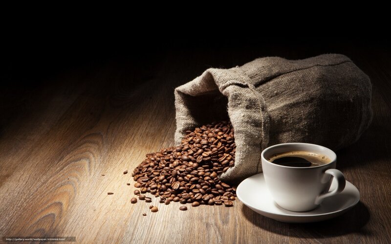 coffee beans and cup on wood