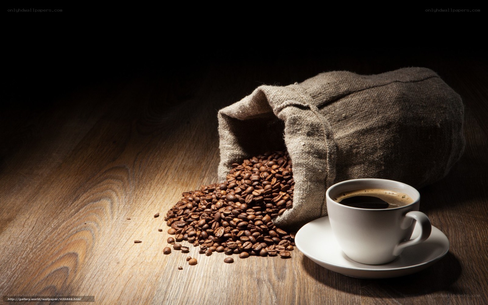 coffee beans and cup on wood