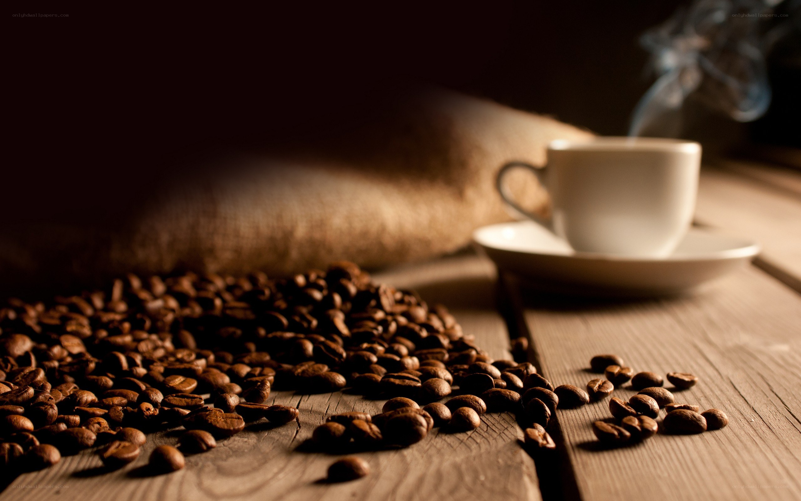 coffee beans and steaming cup