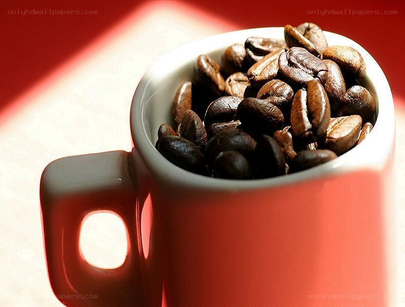 coffee beans in a red mug