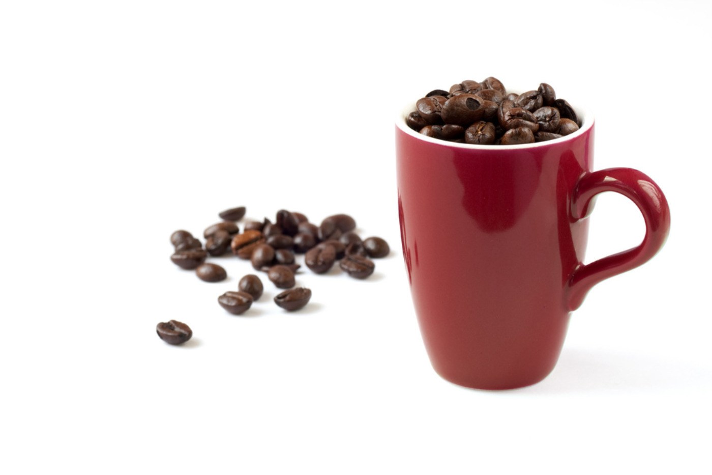 coffee beans in a red mug