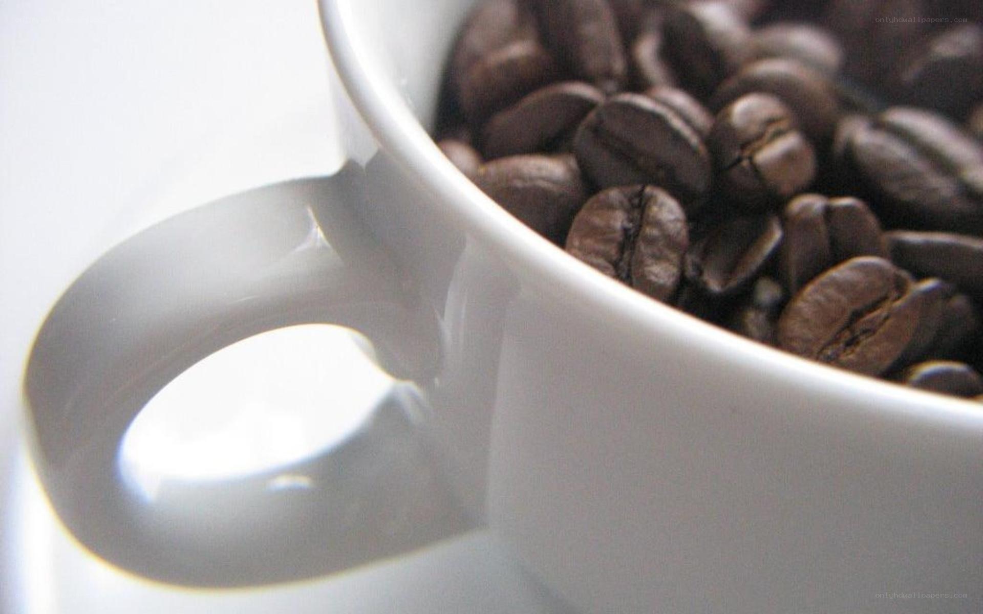 coffee beans in a white cup