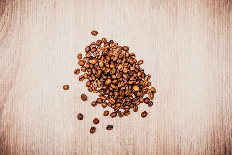 coffee beans on wood surface
