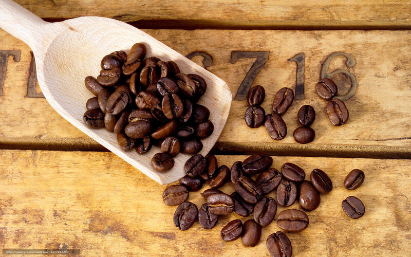 coffee beans on wooden surface