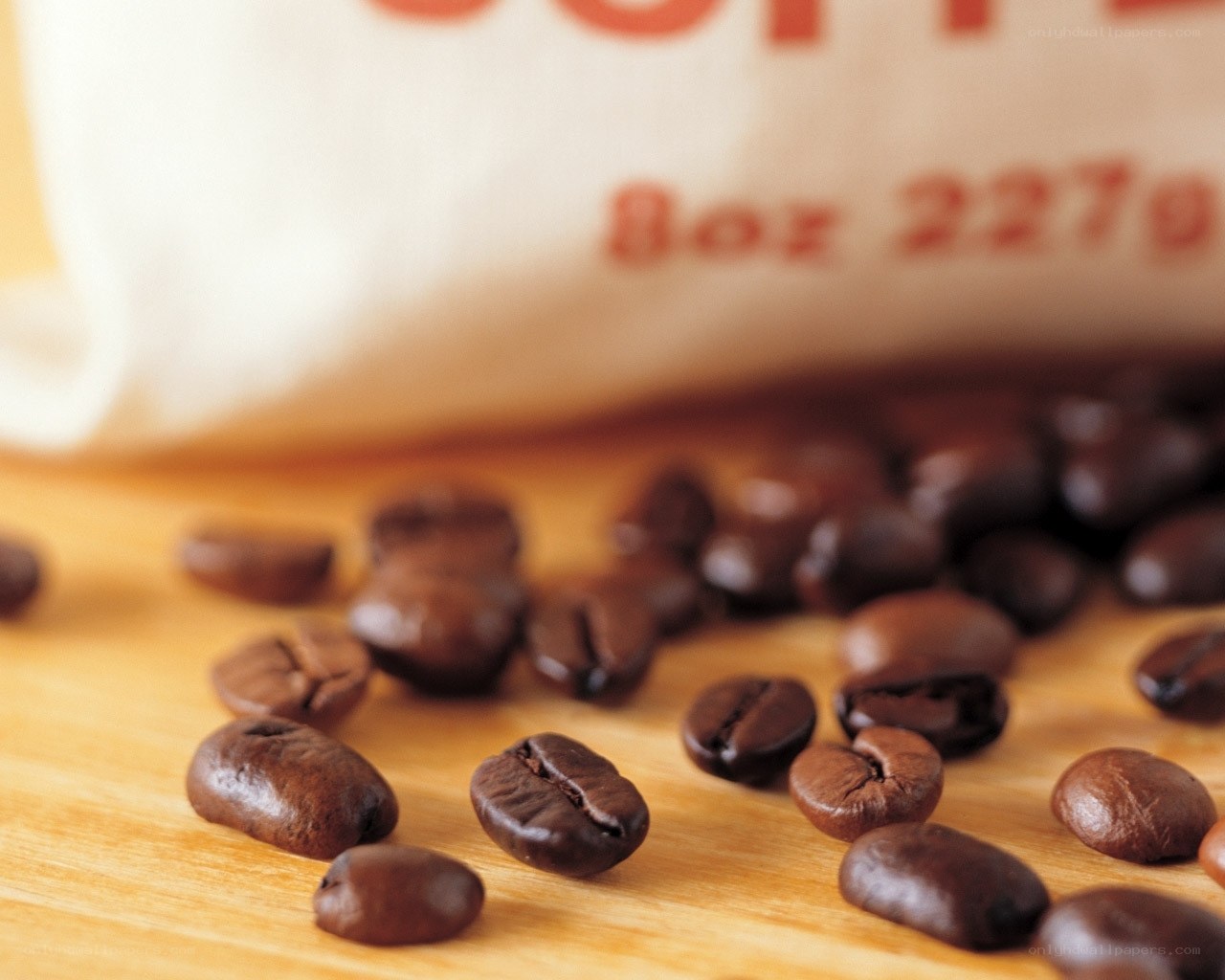 coffee beans on wooden surface