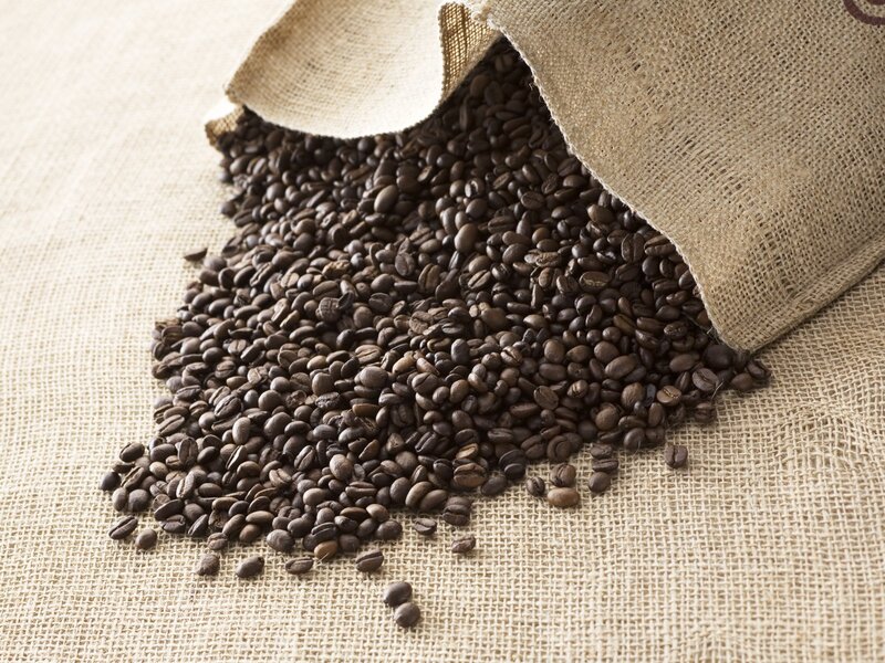 coffee beans spilling from burlap sack