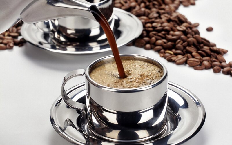 coffee being poured into cup