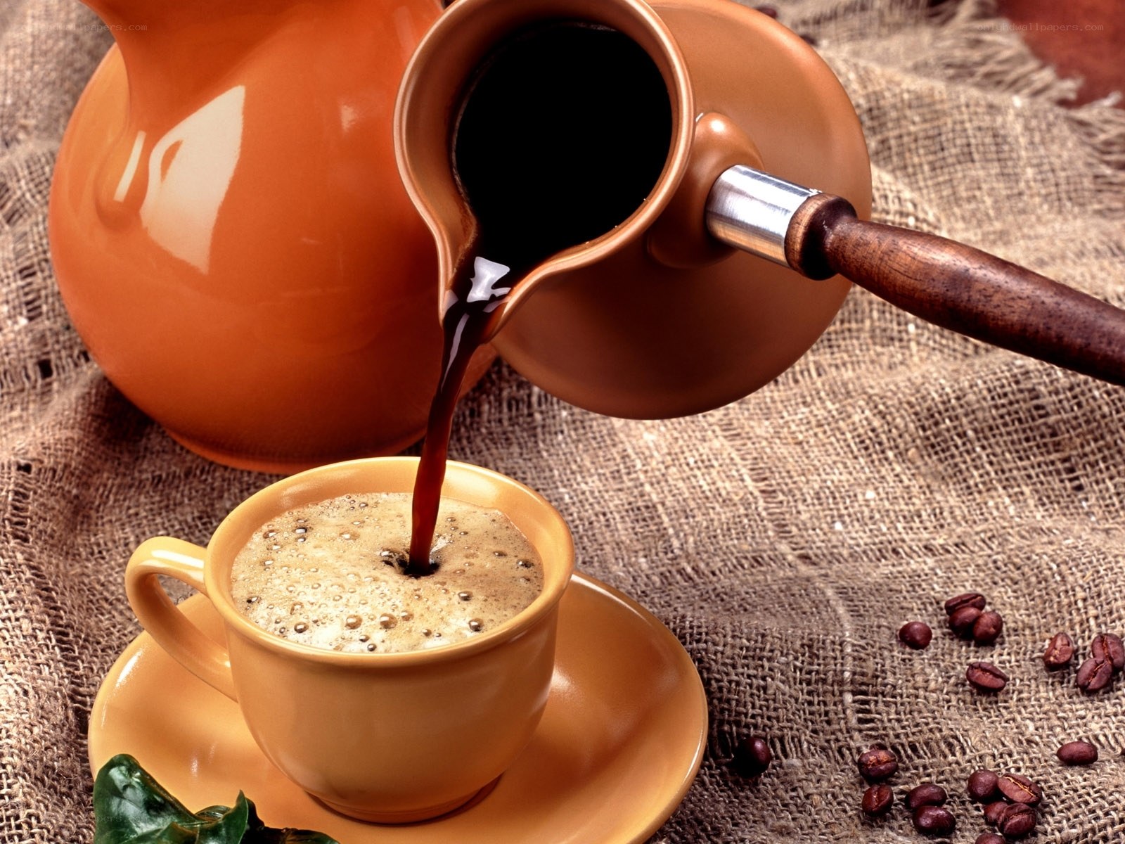 coffee being poured into cup