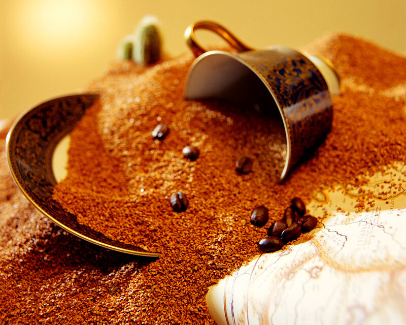 coffee cup in sand