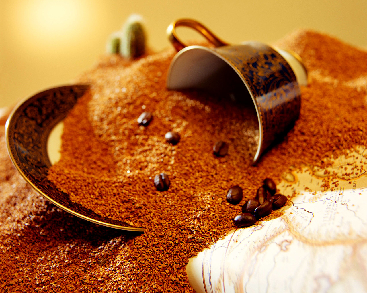 coffee cup in sand