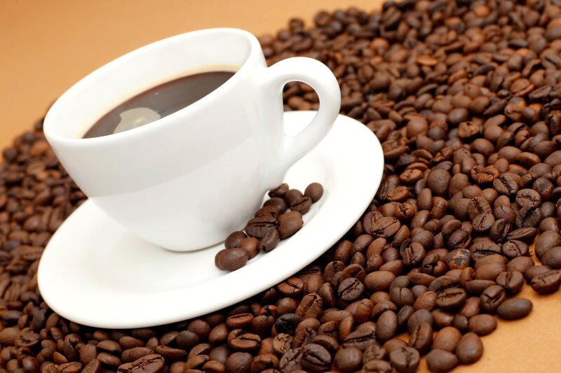 Coffee Cup on Beans — Photograph