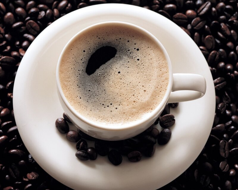 coffee cup on coffee beans