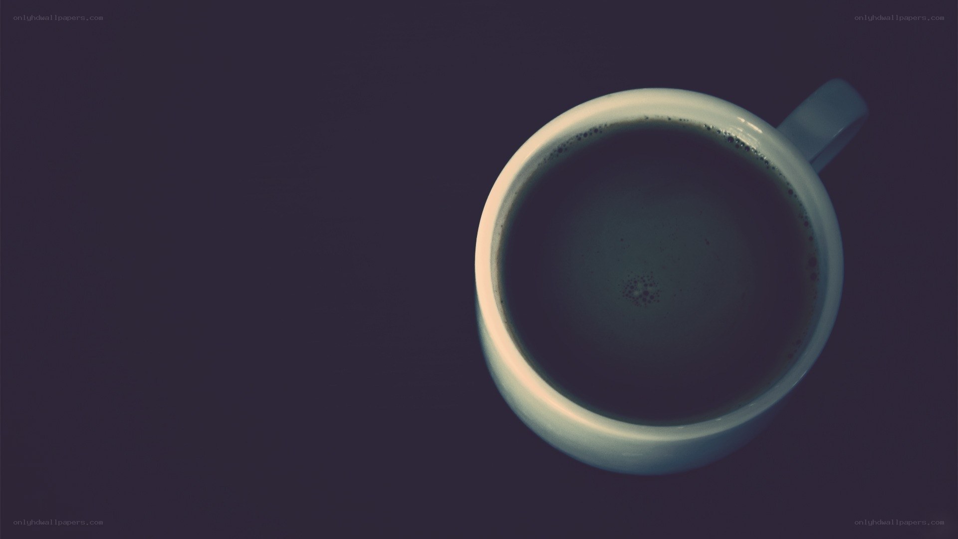 coffee cup on dark surface
