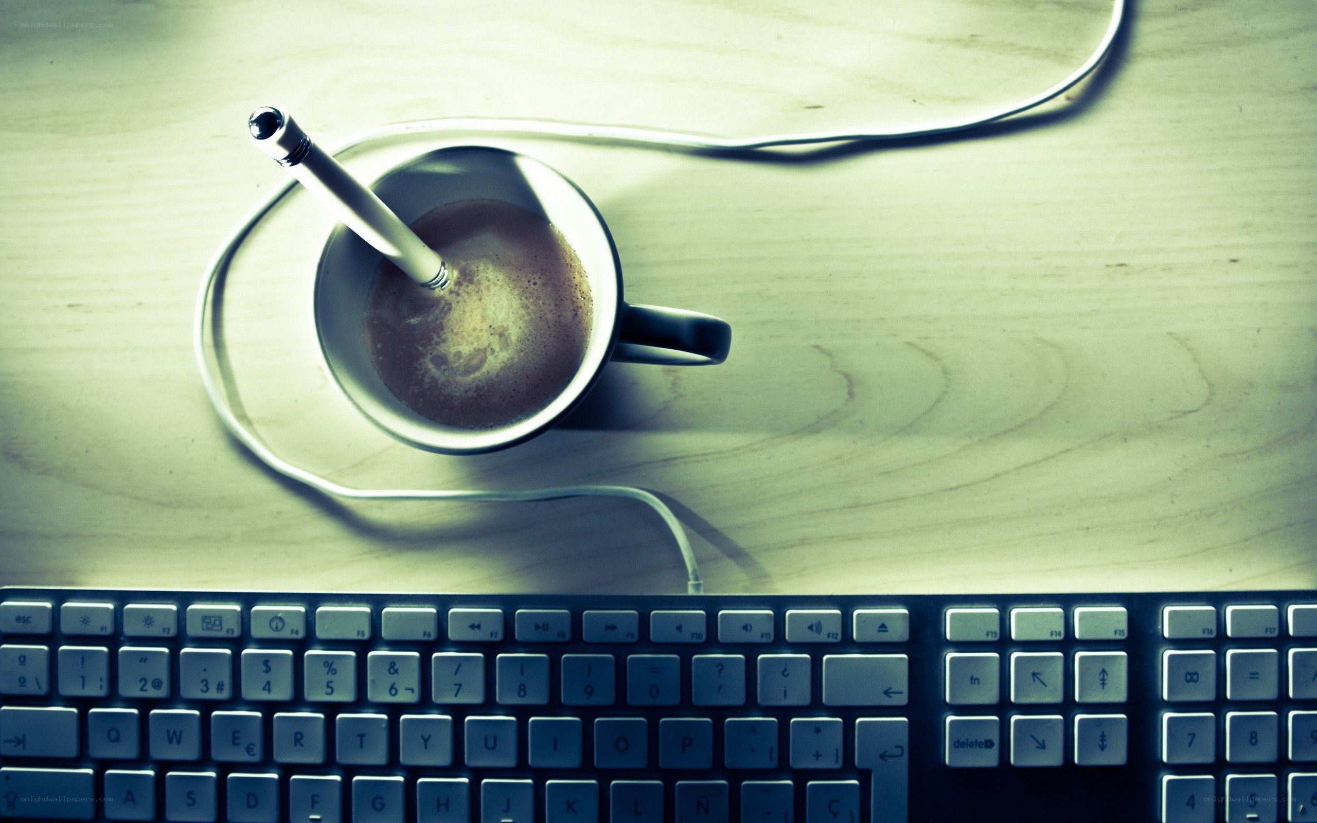 coffee cup on desk with pen