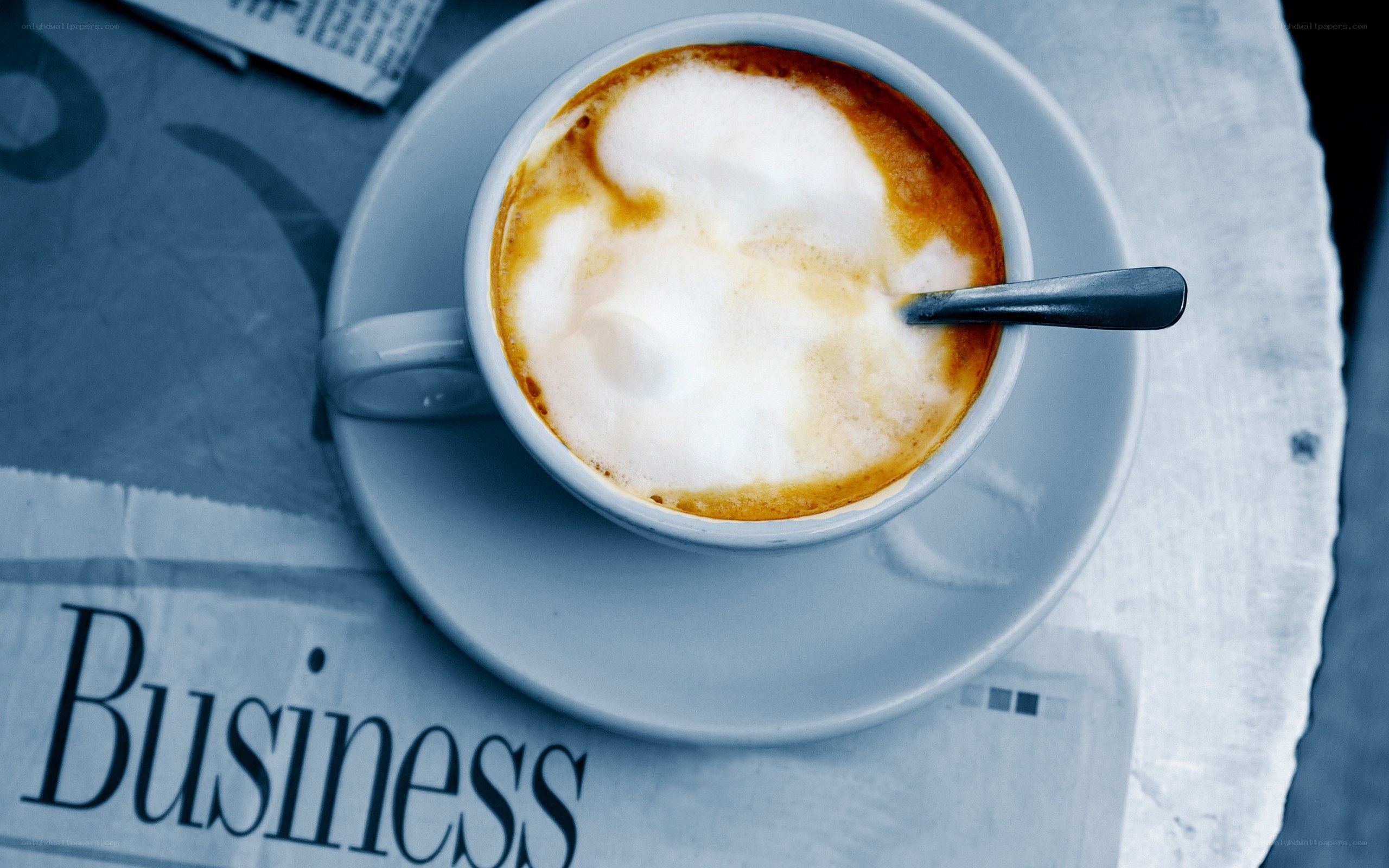 coffee cup on newspaper