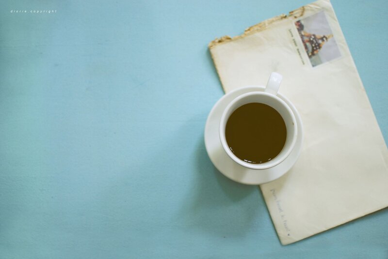coffee cup on old letter
