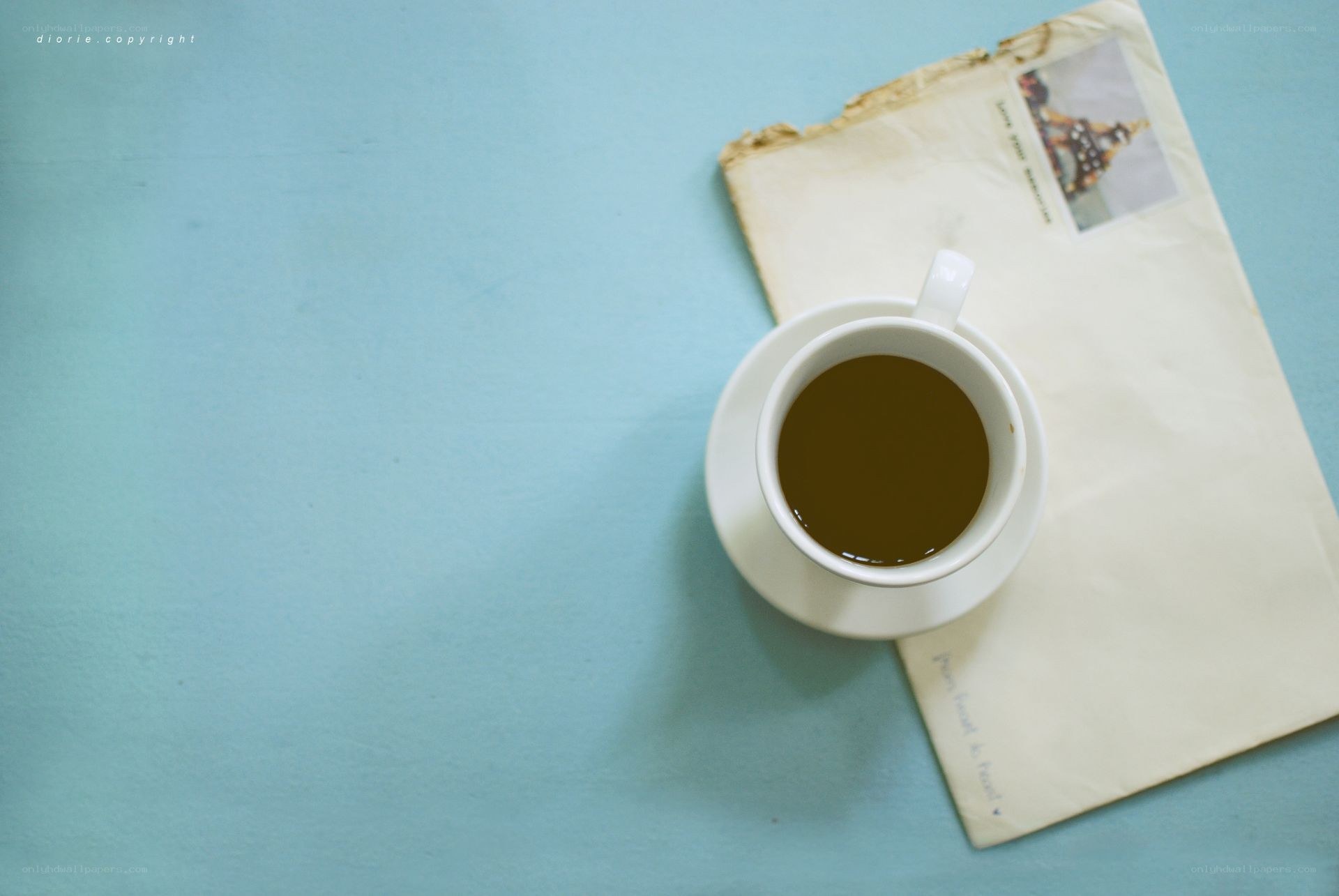 coffee cup on old letter
