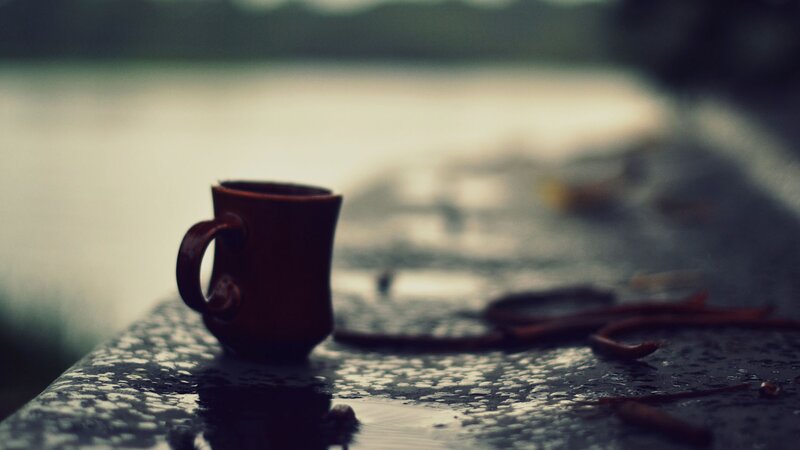 coffee cup on rainy surface
