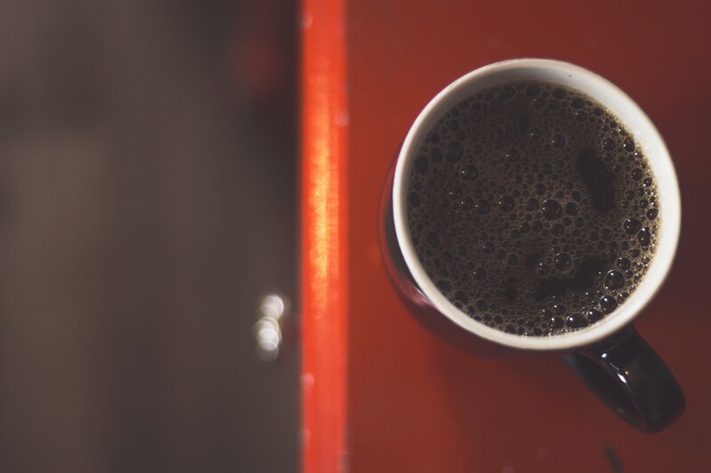 coffee cup on red surface