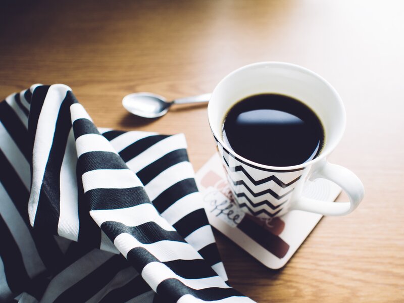 Coffee Cup on Table — Black