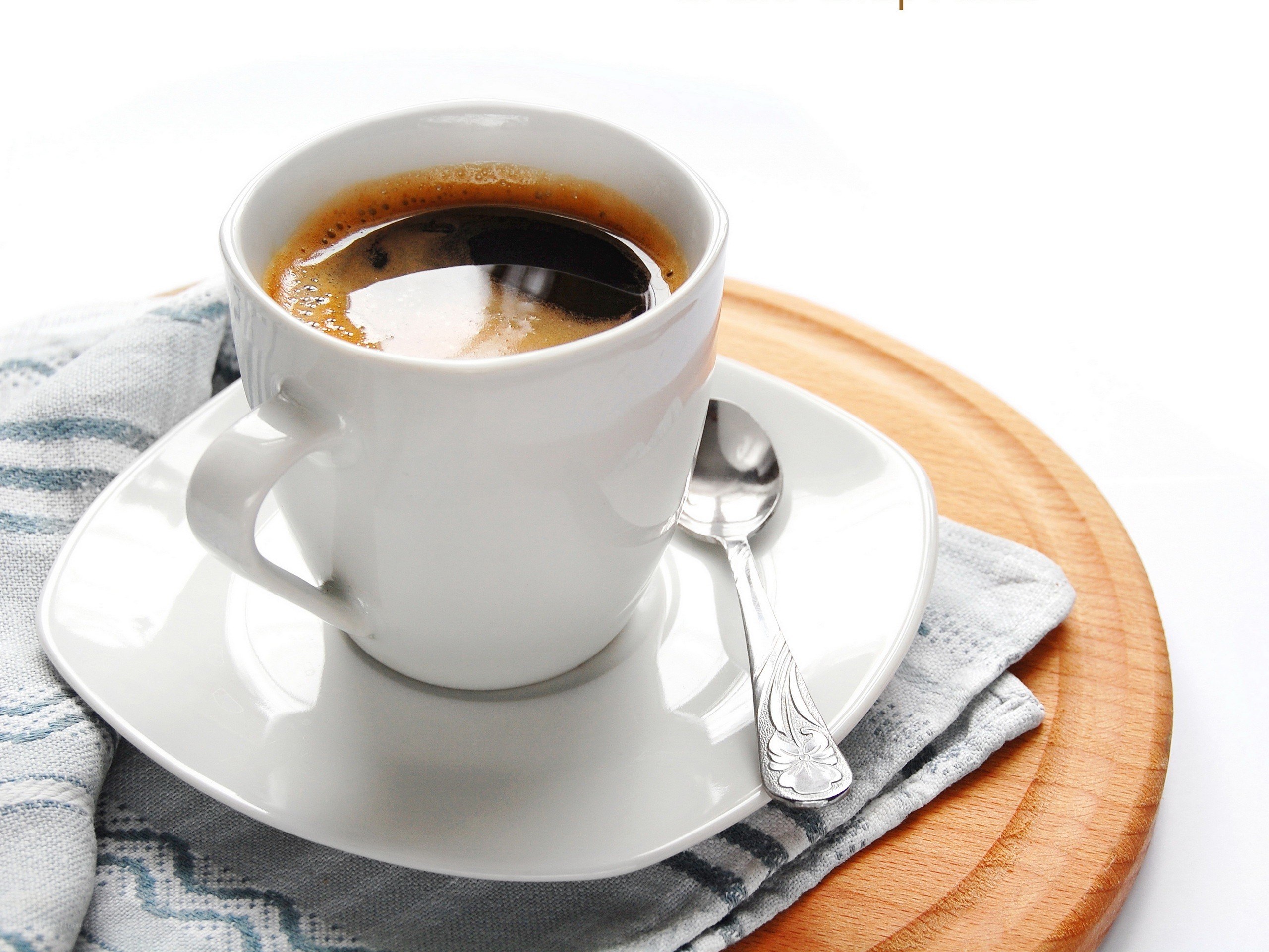 coffee cup on wooden board