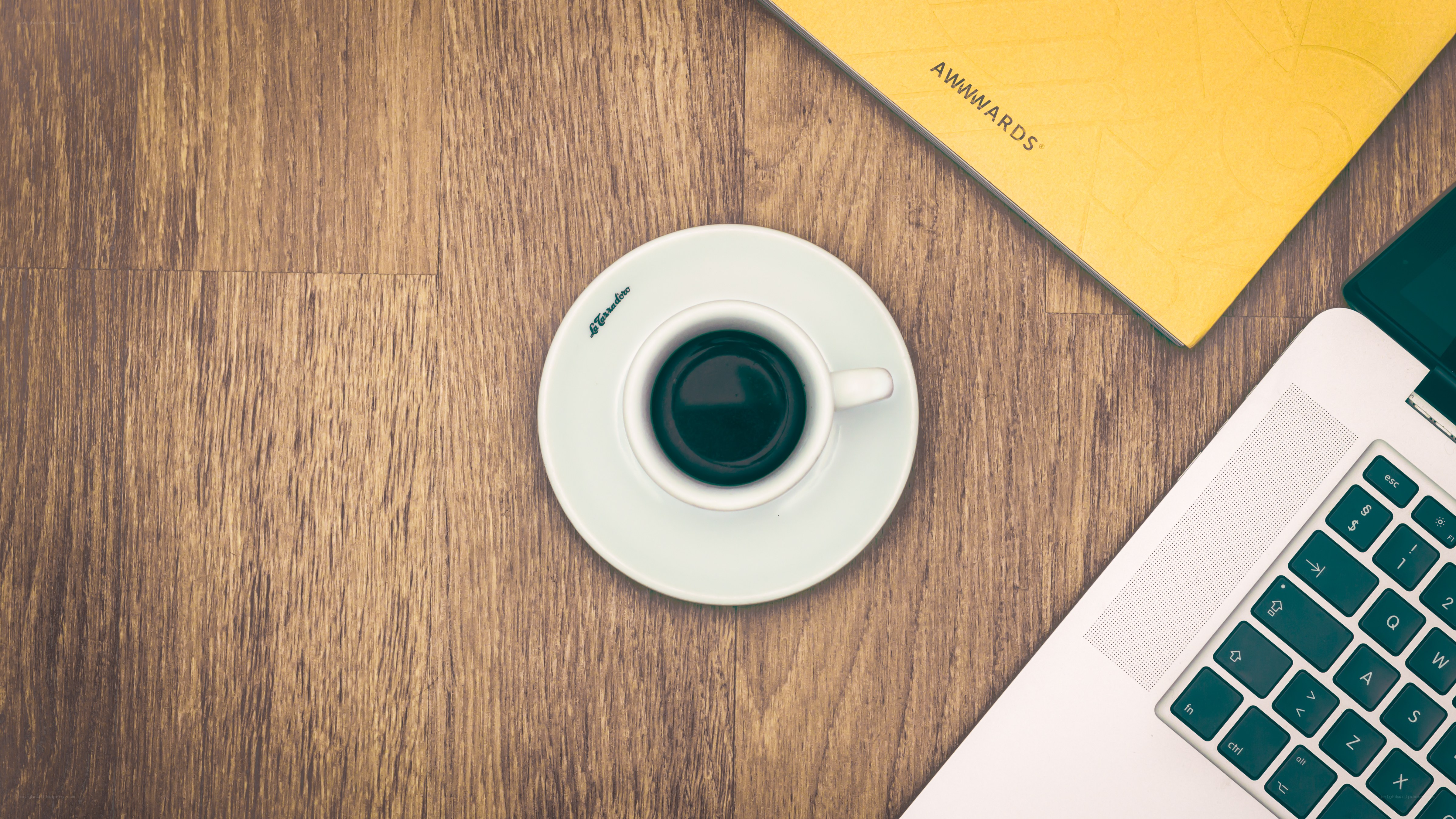 coffee cup on wooden desk