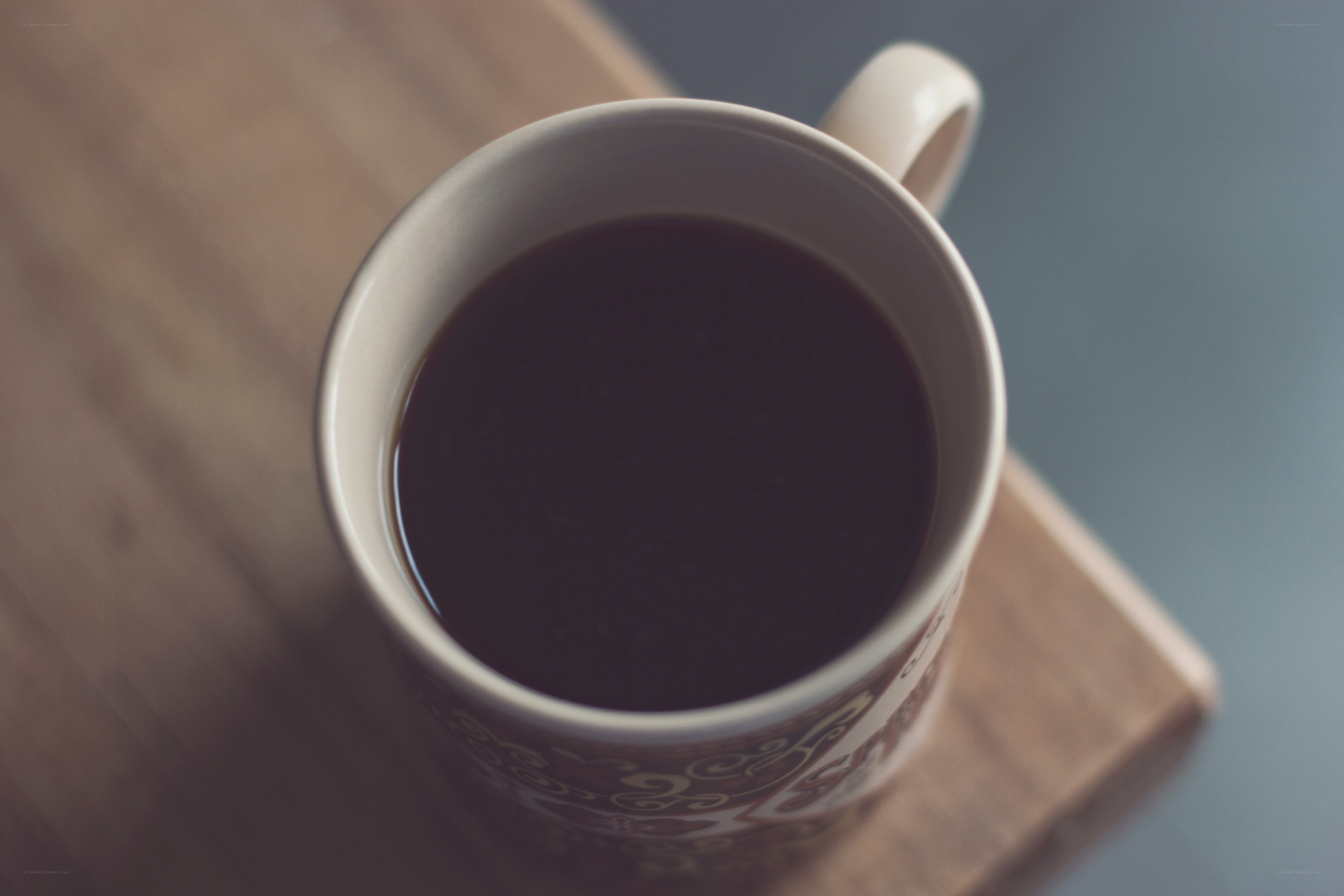 coffee cup on wooden surface