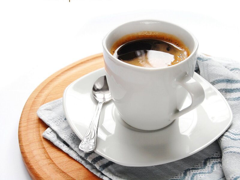 coffee cup on wooden tray