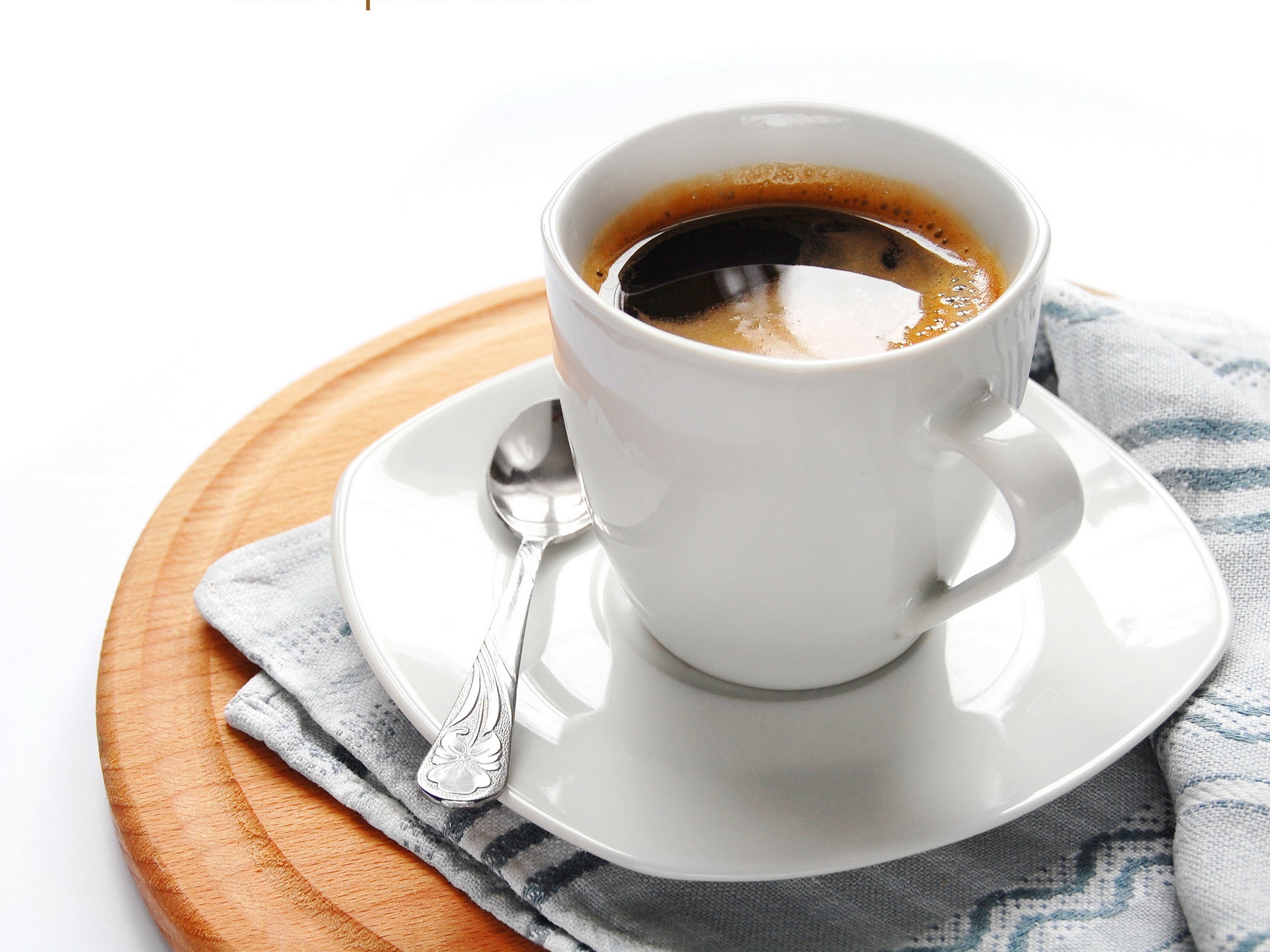 coffee cup on wooden tray